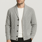 Men's classic fit cardigan made from soft merino wool featuring a button placket, ideal for versatile layering in casual or formal settings. 0