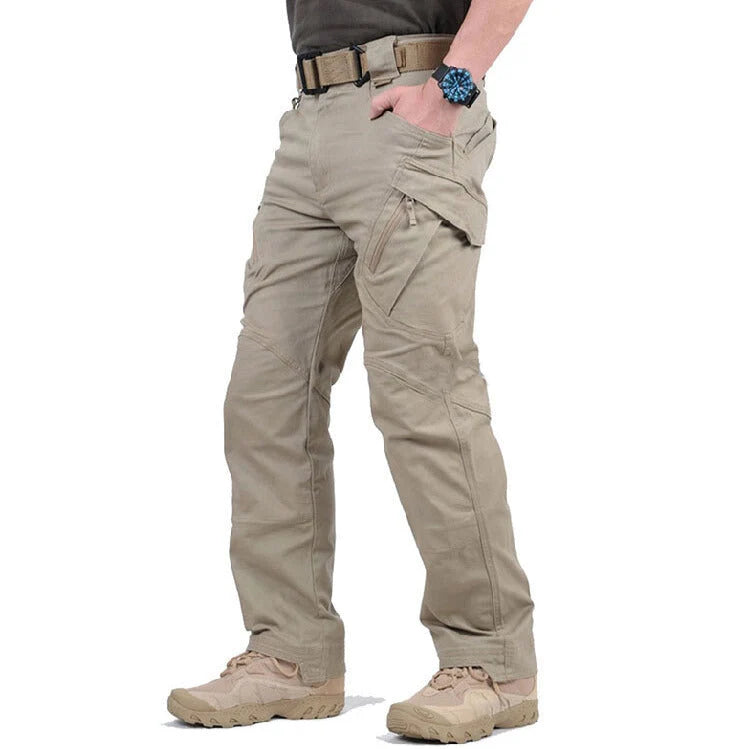 Men's black cargo pants featuring multiple pockets and reinforced seams, designed for hiking and outdoor activities. 0