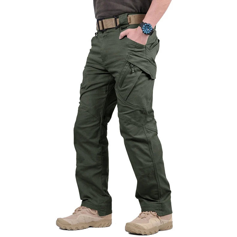 Men's black cargo pants featuring multiple pockets and reinforced seams, designed for hiking and outdoor activities. 3