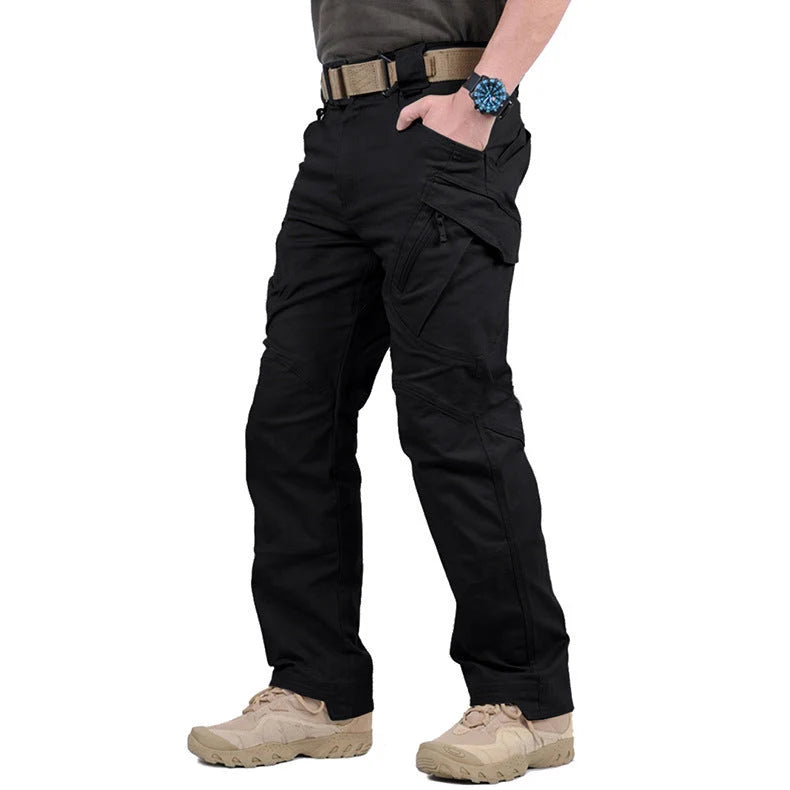 Men's black cargo pants featuring multiple pockets and reinforced seams, designed for hiking and outdoor activities. 4