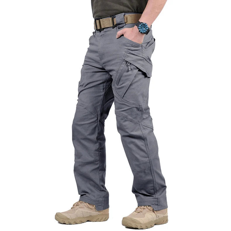 Men's black cargo pants featuring multiple pockets and reinforced seams, designed for hiking and outdoor activities. 5