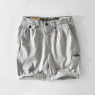 Men's cargo shorts featuring spacious pockets, made from lightweight breathable cotton, perfect for summer casual wear. 1