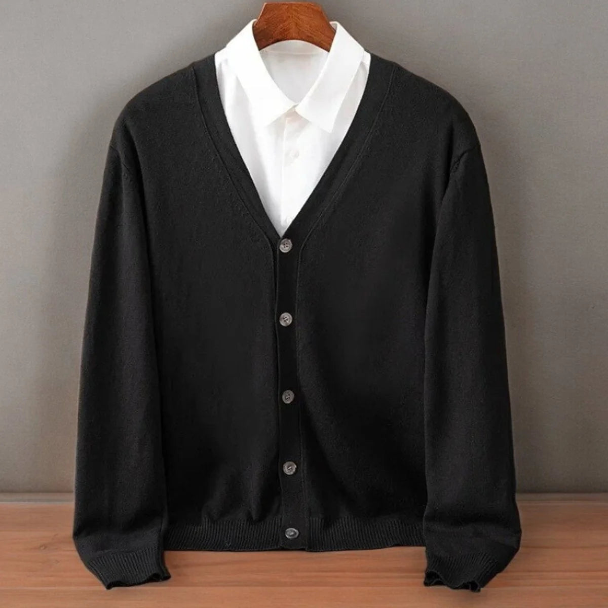 Men's cashmere cardigan in soft black featuring a button-up front and elegant V-neck design, perfect for stylish layering and comfort. 3
