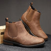 Men's tan faux-leather Chelsea boots featuring elastic side panels and stylish western stitching, perfect for a trendy and comfortable footwear choice. 0