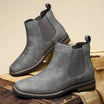 Men's tan faux-leather Chelsea boots featuring elastic side panels and stylish western stitching, perfect for a trendy and comfortable footwear choice. 6