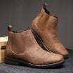 Men's tan faux leather Chelsea boots featuring elastic side panels and western stitching, perfect for stylish casual wear. 0