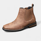 Men's tan faux leather Chelsea boots featuring elastic side panels and western stitching, perfect for stylish casual wear. 1