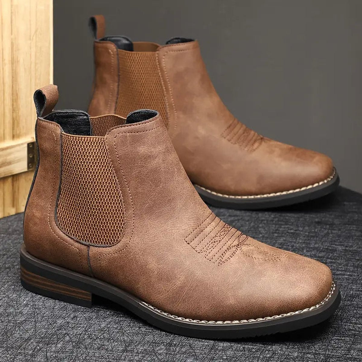 Men's tan faux leather Chelsea boots featuring elastic side panels and western stitching, perfect for stylish casual wear. 4