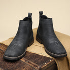 Men's tan faux leather Chelsea boots featuring elastic side panels and western stitching, perfect for stylish casual wear. 9