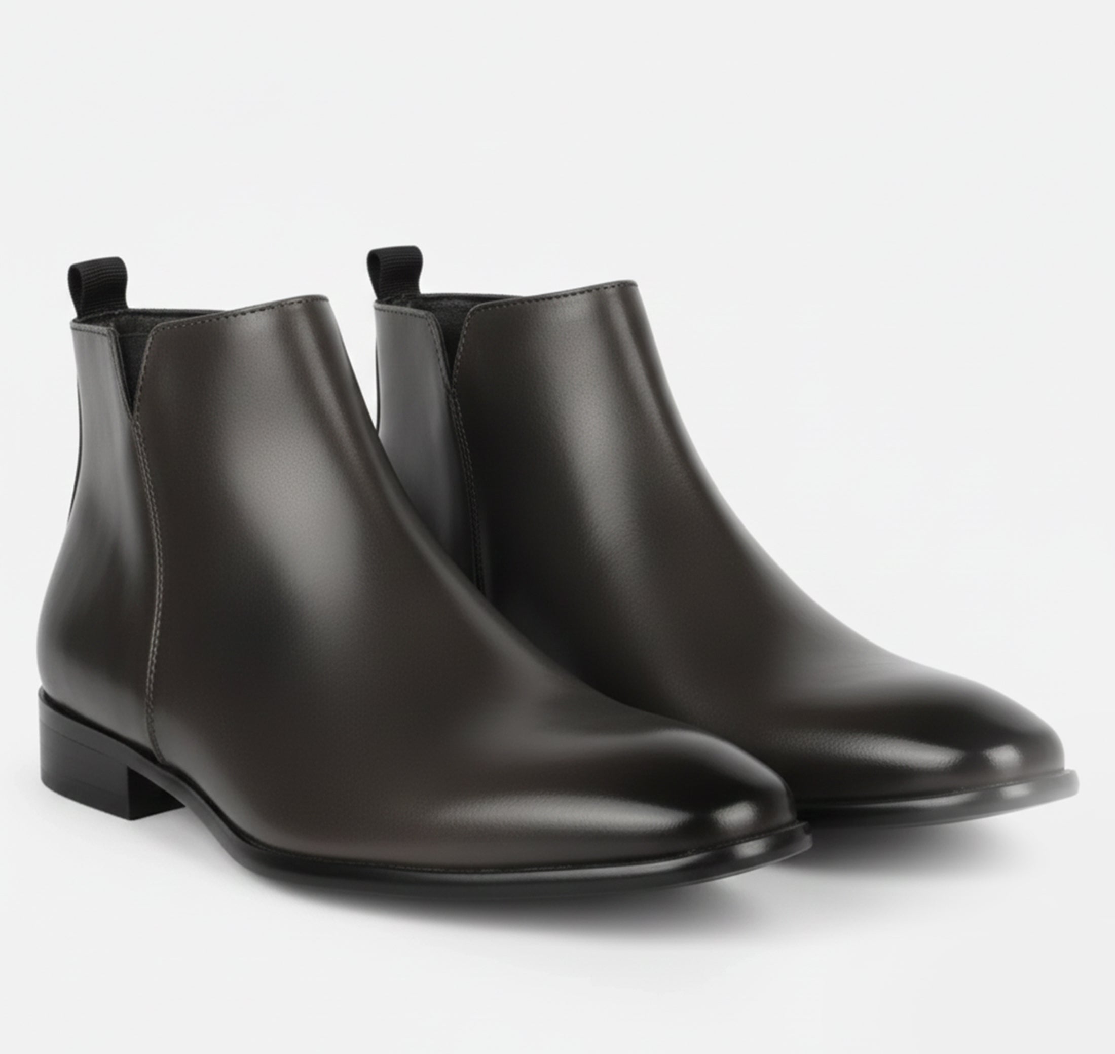 Men's Chelsea boots featuring a sleek squared toe design and a polished finish, perfect for stylish and sophisticated footwear options. 6