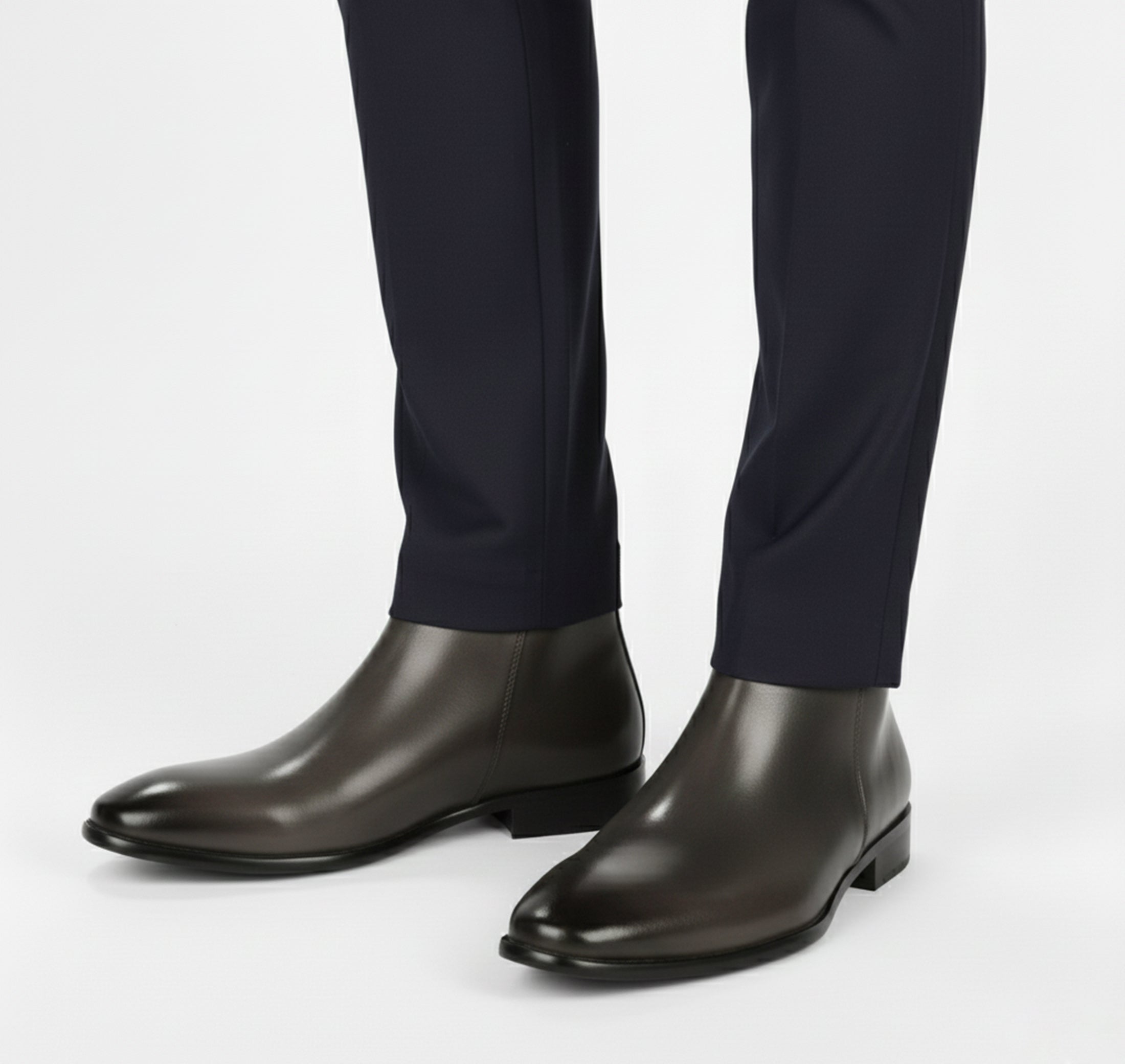 Men's Chelsea boots featuring a sleek squared toe design and a polished finish, perfect for stylish and sophisticated footwear options. 7