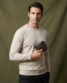 Men's cowhide leather zip wallet featuring a slim profile, durable design, and compact size, perfect for everyday use. 4