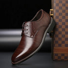 Men's black lace-up dress shoes featuring a comfortable fit and timeless design, perfect for formal occasions and professional settings. 1