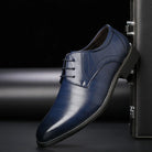 Men's black lace-up dress shoes featuring a comfortable fit and timeless design, perfect for formal occasions and professional settings. 2