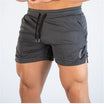 Men's mid waist polyester gym shorts featuring a drawstring closure for a comfortable fit, perfect for athletic activities and workouts. 0
