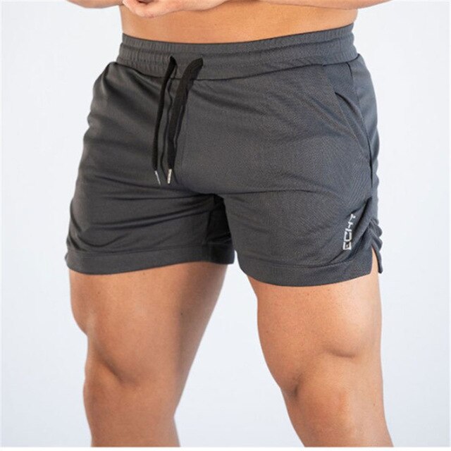 Men's mid waist polyester gym shorts featuring a drawstring closure for a comfortable fit, perfect for athletic activities and workouts. 0