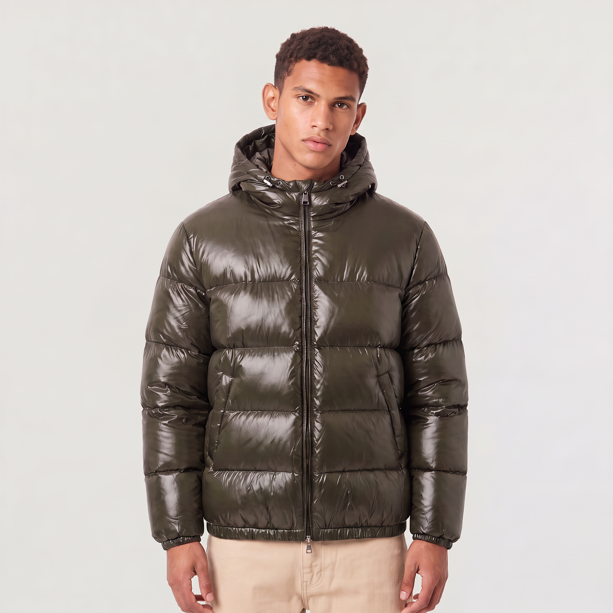 Men's hooded puffer jacket featuring zip pockets and a glossy quilted finish, designed for a relaxed fit, perfect for winter wear. 0