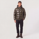 Men's hooded puffer jacket featuring zip pockets and a glossy quilted finish, designed for a relaxed fit, perfect for winter wear. 2