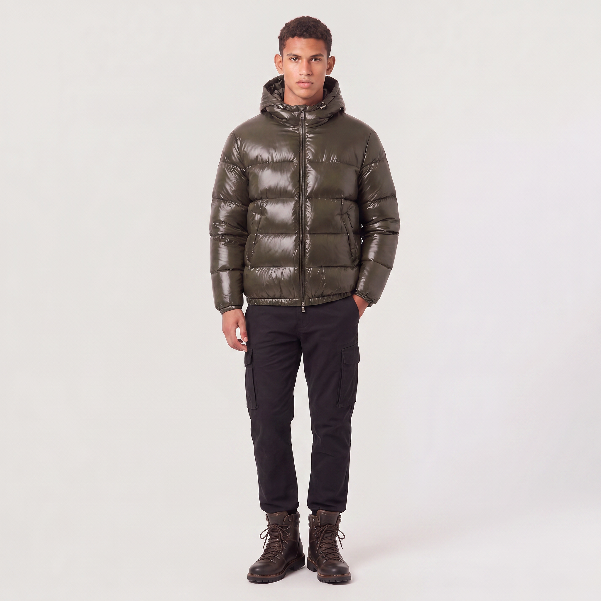 Men's hooded puffer jacket featuring zip pockets and a glossy quilted finish, designed for a relaxed fit, perfect for winter wear. 2