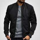Men's insulated bomber jacket featuring a zip pocket, designed for winter warmth with a classic flight coat style. 0