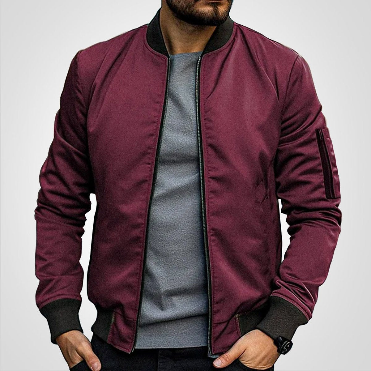 Men's insulated bomber jacket featuring a zip pocket, designed for winter warmth with a classic flight coat style. 2
