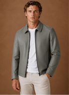 Men's jacket featuring a full-zip closure and side pockets, designed with a classic leather look for a stylish and versatile outerwear option. 0