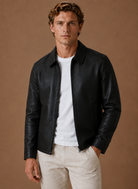Men's jacket featuring a full-zip closure and side pockets, designed with a classic leather look for a stylish and versatile outerwear option. 4