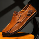 Men's leather slip-on loafers featuring a cushioned insole and a glossy finish, ideal for both casual and formal occasions. 0