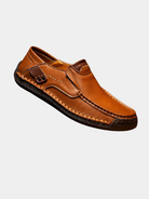 Men's leather slip-on loafers featuring a cushioned insole and a glossy finish, ideal for both casual and formal occasions. 1