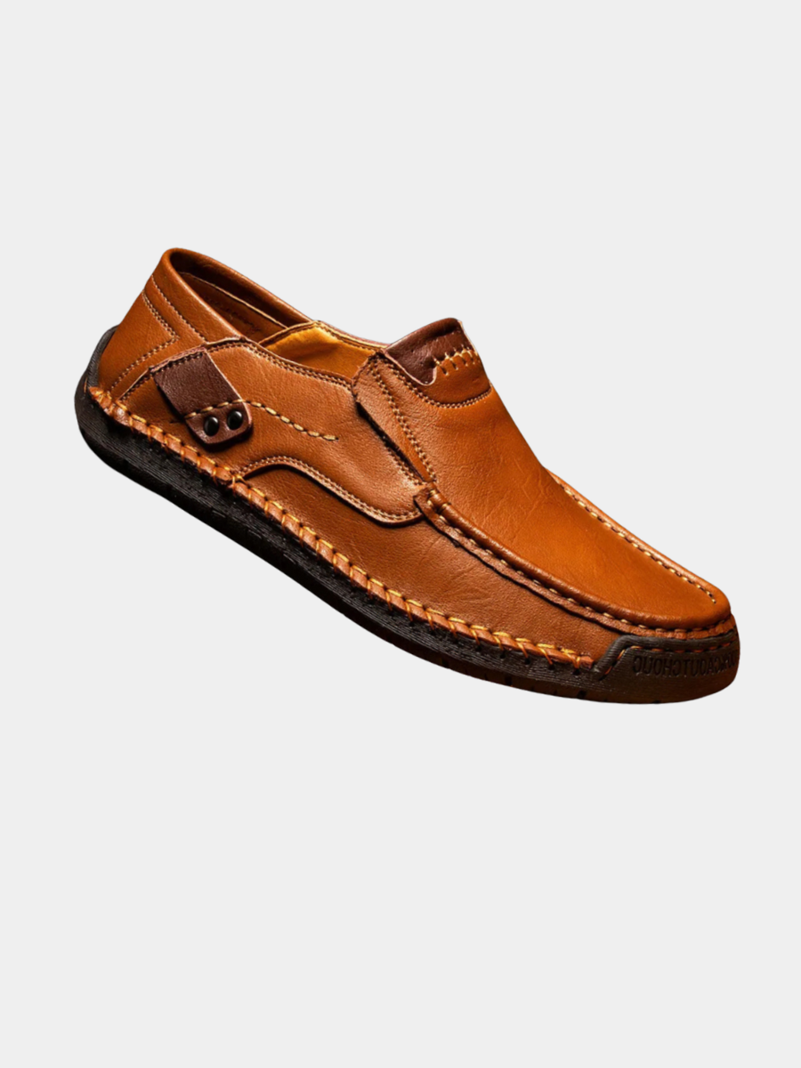 Men's leather slip-on loafers featuring a cushioned insole and a glossy finish, ideal for both casual and formal occasions. 1