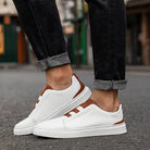 Men's leather slip-on trainers featuring loop lacing, designed for comfort and casual wear, made with a genuine leather upper and durable rubber outsole. 1