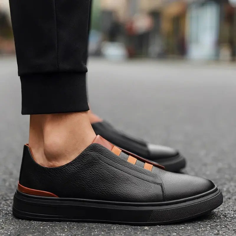 Men's leather slip-on trainers featuring loop lacing, designed for comfort and casual wear, made with a genuine leather upper and durable rubber outsole. 3