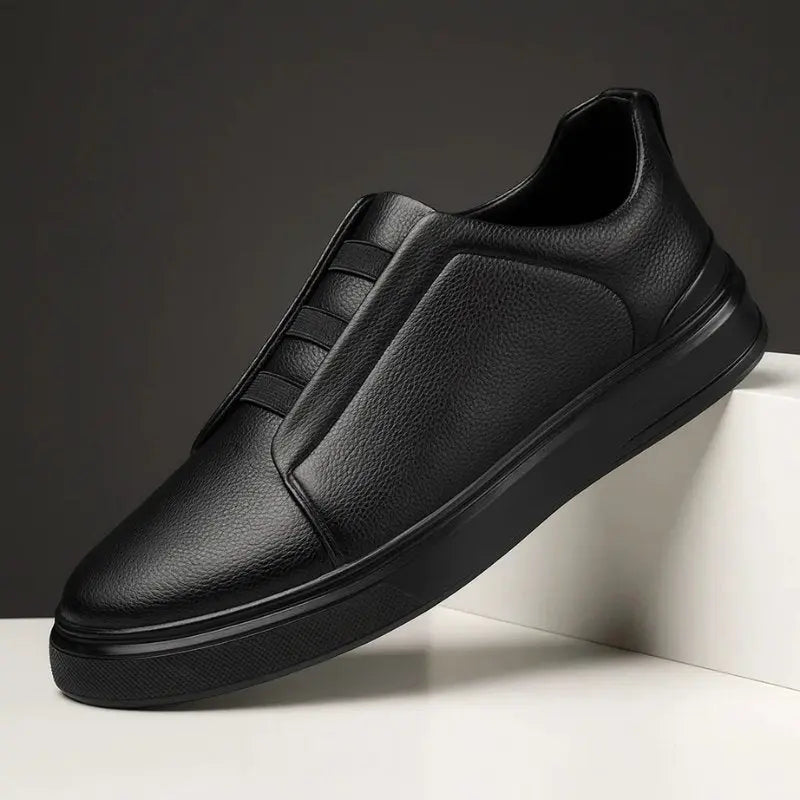Men's leather slip-on trainers featuring loop lacing, designed for comfort and casual wear, made with a genuine leather upper and durable rubber outsole. 4