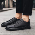 Men's leather slip-on trainers featuring loop lacing, designed for comfort and casual wear, made with a genuine leather upper and durable rubber outsole. 5