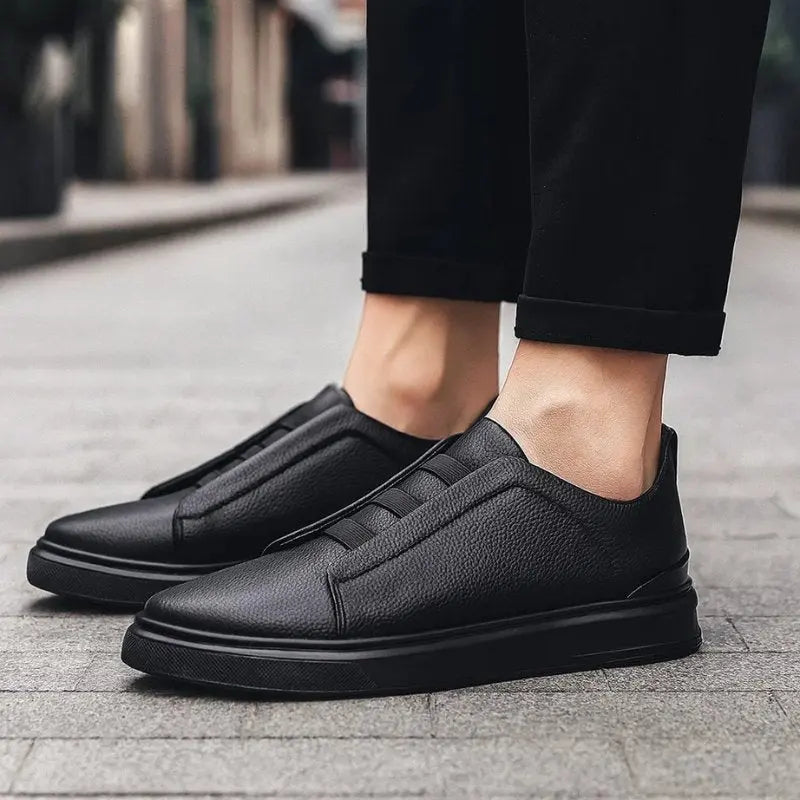 Men's leather slip-on trainers featuring loop lacing, designed for comfort and casual wear, made with a genuine leather upper and durable rubber outsole. 5