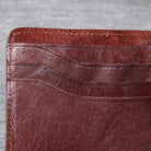 Men's leather wallet featuring a slim bi-fold design, durable cowhide material, and a convenient snap coin pocket, ideal for stylish and organized storage. 4