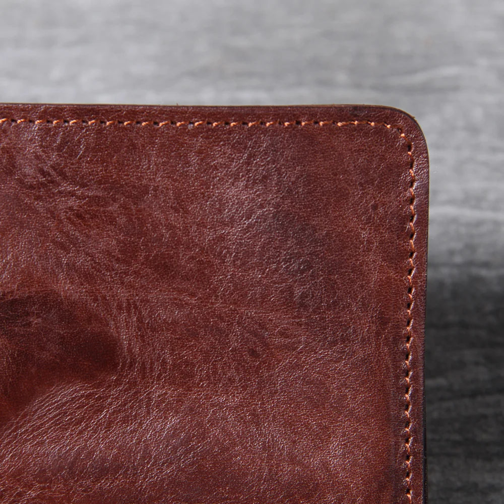 Men's leather wallet featuring a slim bi-fold design, durable cowhide material, and a convenient snap coin pocket, ideal for stylish and organized storage. 6