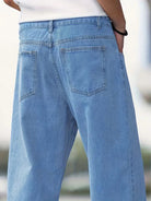 Men's mid-rise baggy jeans featuring a light wash and relaxed fit, perfect for casual wear and comfortable style. 5