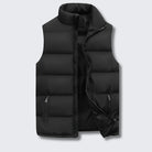 Men's quilted vest featuring functional pockets and a modern design, perfect for lightweight layering during transitional seasons. 0