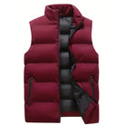 Men's quilted vest featuring functional pockets and a modern design, perfect for lightweight layering during transitional seasons. 3