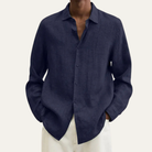 Men's long sleeve button-up shirt featuring a relaxed fit and smooth woven fabric, available in multiple colors for versatile styling. 4