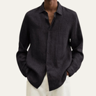 Men's long sleeve button-up shirt featuring a relaxed fit and smooth woven fabric, available in multiple colors for versatile styling. 5
