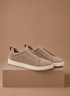 Men's beige suede sneakers slip-on featuring elastic details for comfort, perfect for casual wear and stylish outfits. 0