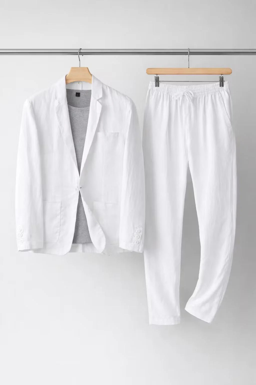 Men's suit set featuring a relaxed fit blazer and trousers made from breathable linen fabric, perfect for versatile formal and casual occasions. 9