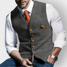 Men's tailored slim-fit herringbone tweed vest gilet featuring stylish wooden buttons, perfect for smart casual or formal wear. 3
