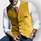 Men's tailored slim-fit herringbone tweed vest gilet featuring stylish wooden buttons, perfect for smart casual or formal wear. 4