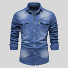 Men's washed denim shirt featuring a button-up front, long sleeves, and twin flap pockets, perfect for casual wear. 2