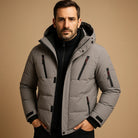 Men's winter jacket featuring a thick padded design and durable zipper, perfect for outdoor activities in cold weather. 1