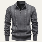 Men's zip up cardigan in soft black knit featuring a stylish stand collar and intricate cable knit design, perfect for layering in cooler weather. 1