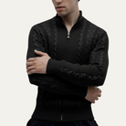 Men's zip up cardigan in soft black knit featuring a stylish stand collar and intricate cable knit design, perfect for layering in cooler weather. 2